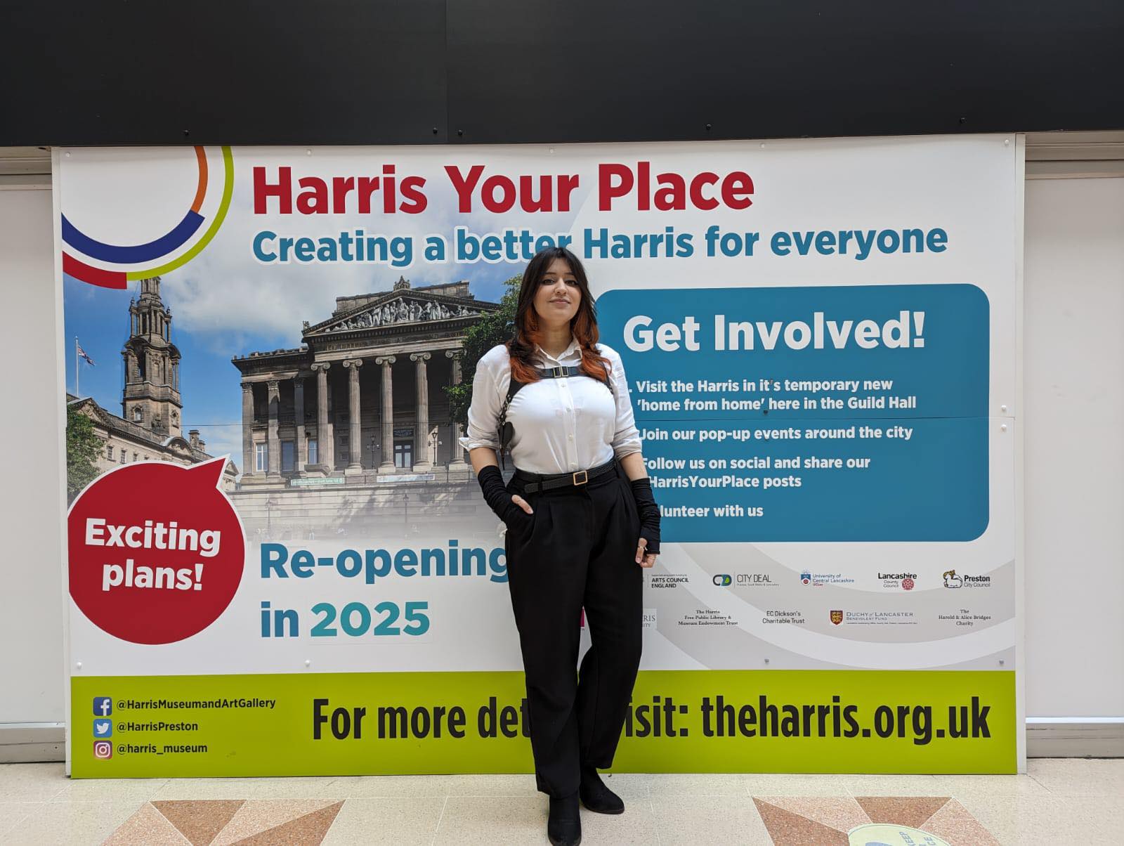 Person standing in front of the Harris Your Place sign.