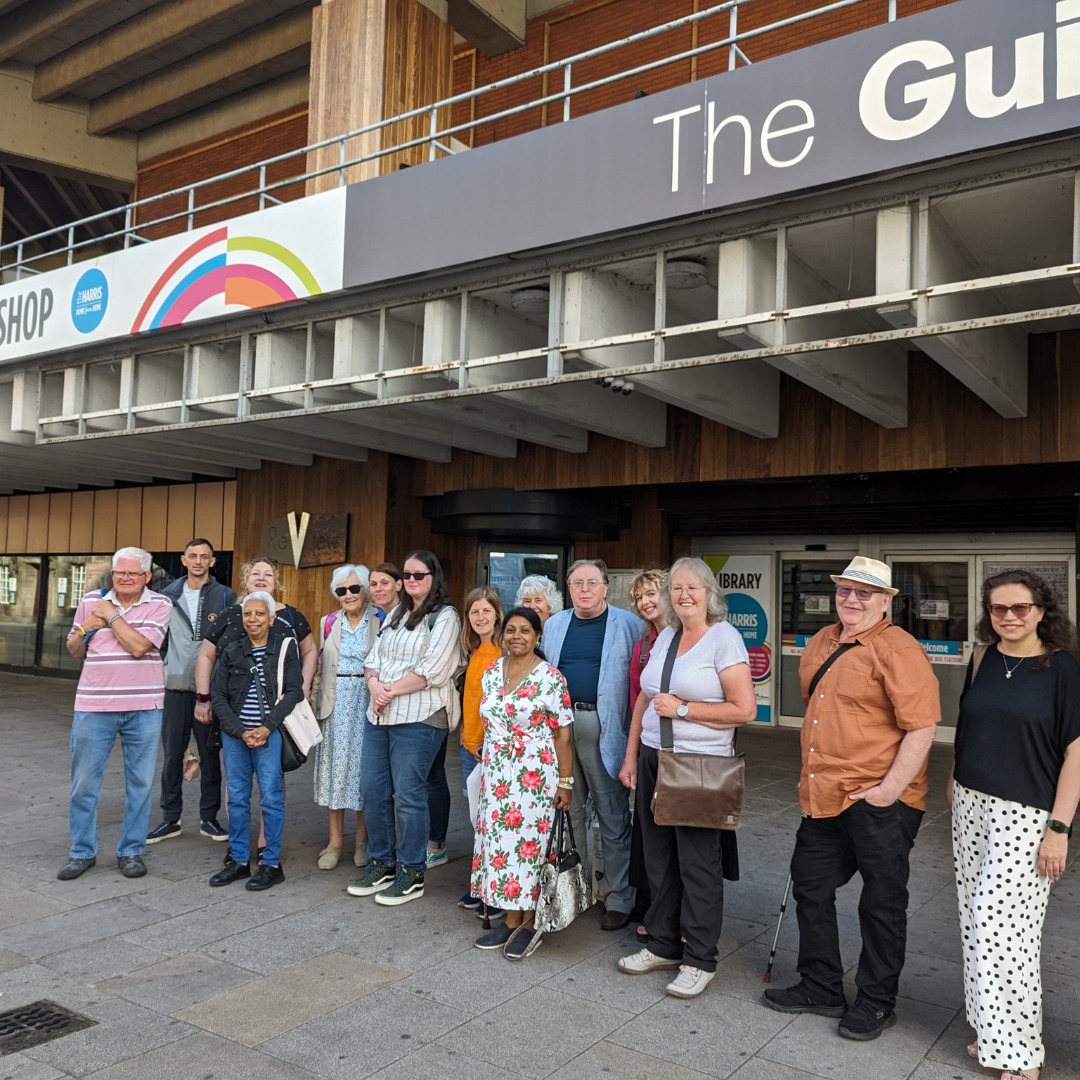 Image of people standing outside of the Guild Hall