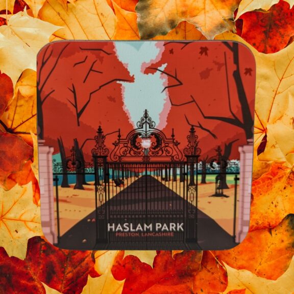 Image of a coaster with 'Haslam Park' written on it on a background on orange and red leaves.