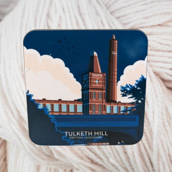 Image of a coaster with 'Tulketh Mill' written on it on a background of white cotton.