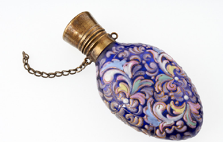 A purple oval shaped glass bottle.