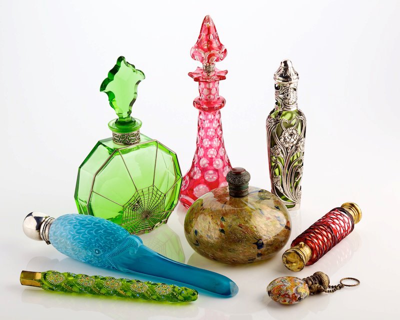 A collection of colourful scent bottles in different shapes and sizes.