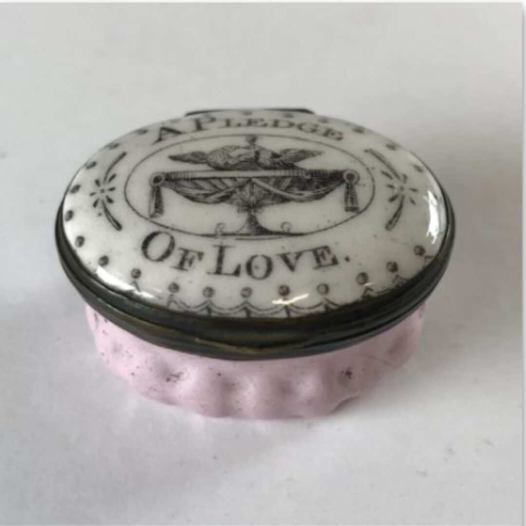 A white enamel patch box.