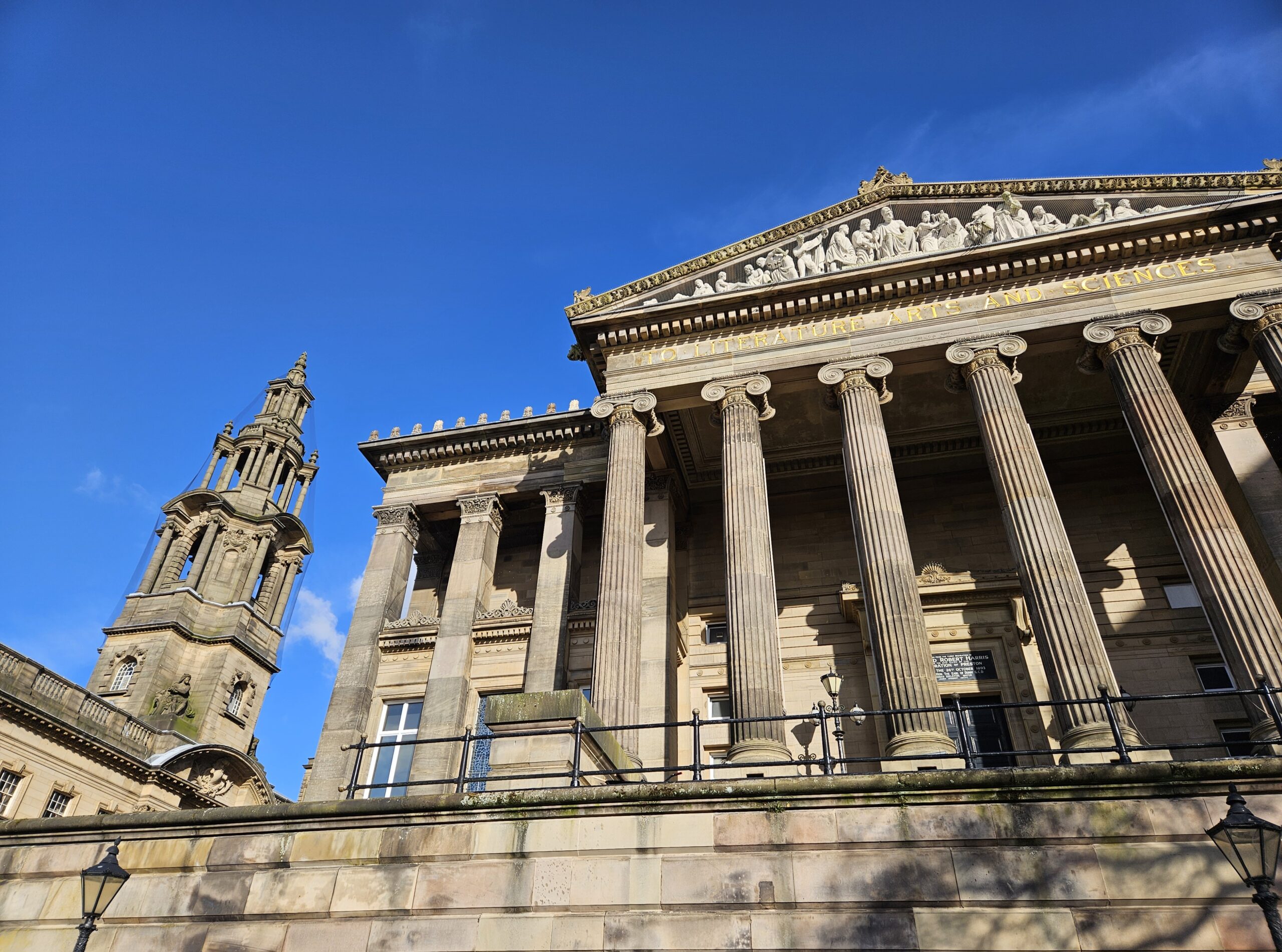 An exterior view of the Harris and Sessions House with blue sky in the background.