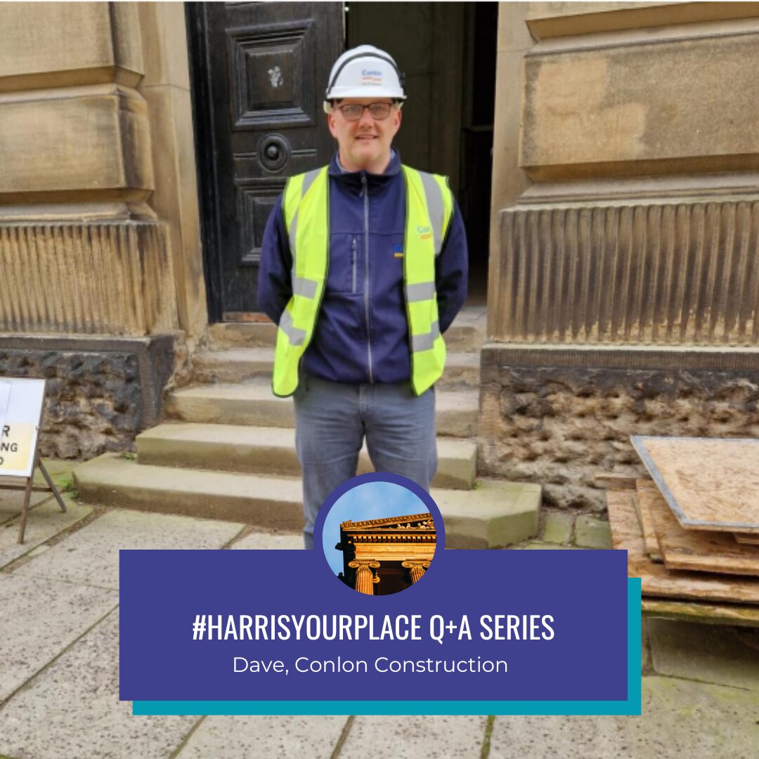 A person wearing a hard hat and high vis jacket stands outside the Harris.