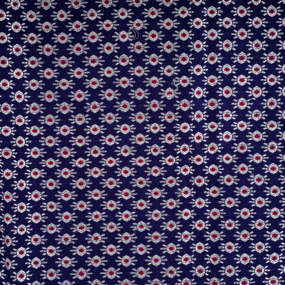 Woven Himroo textiles, one dark background with silver woven pattern.