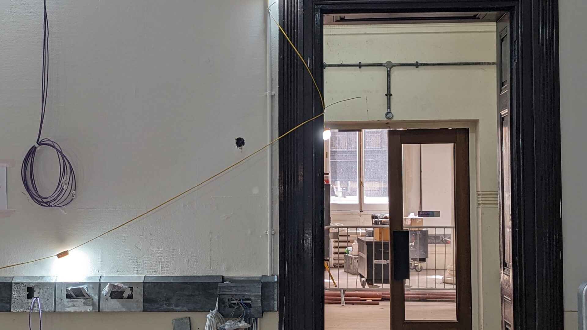 Image of a wooden door frame in The Harris.
