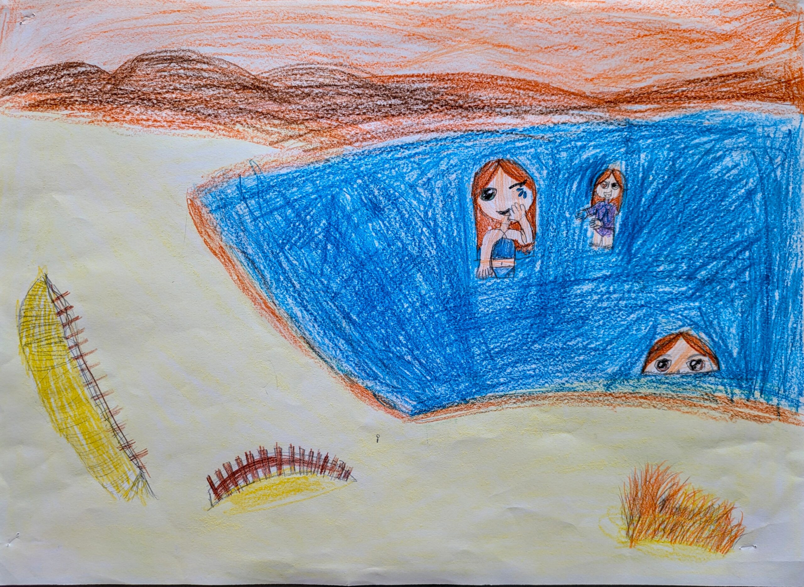 Image of a beach scene with three people.
