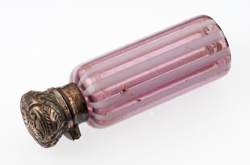 A pale pink scent bottle.