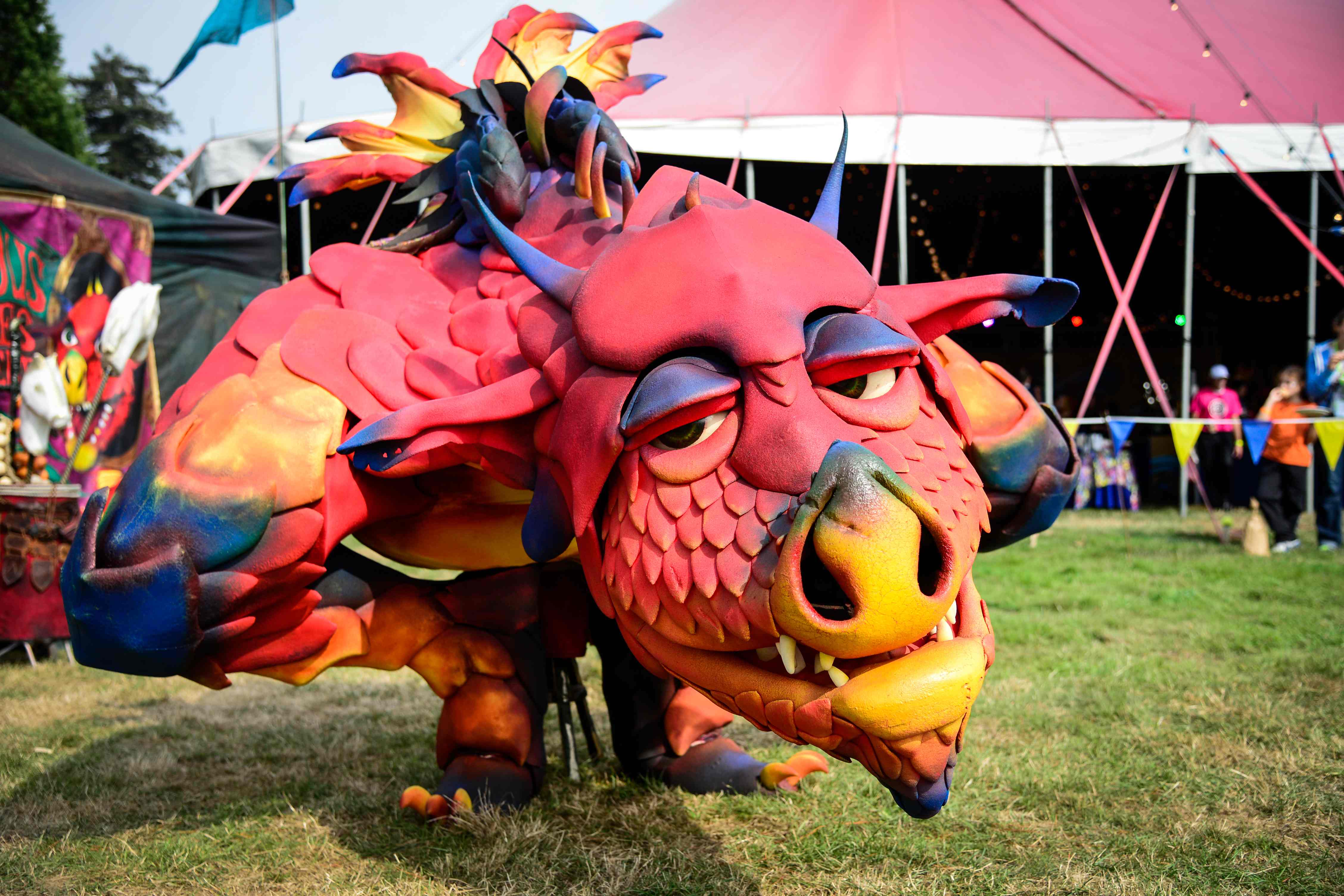 A large red dragon puppet.